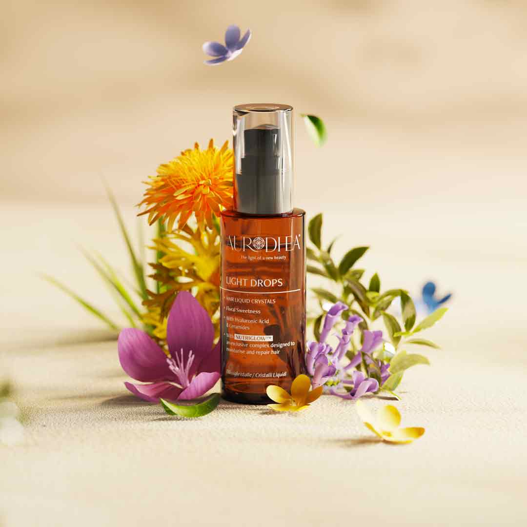 Light Drops Aurodhea présenté en flacon ambré avec packaging rose, sérum nourrissant sans silicones.