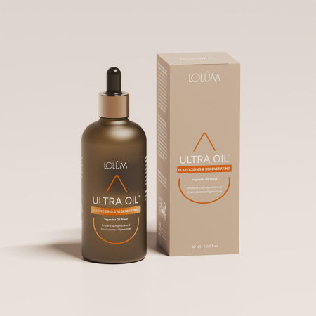 Huile ULTRA OIL™ posée sur un fond doux naturel, soin nutritif pour peaux sèches et cheveux abîmés.